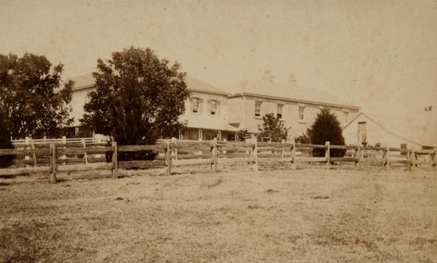 Auctionsplus 13.5.22 Taken around 1870, this photo shows the new two storey kitchen wing added to the rear after 1850 and the old gable roofed stables on the far right. Credit Sydney Living Museums.